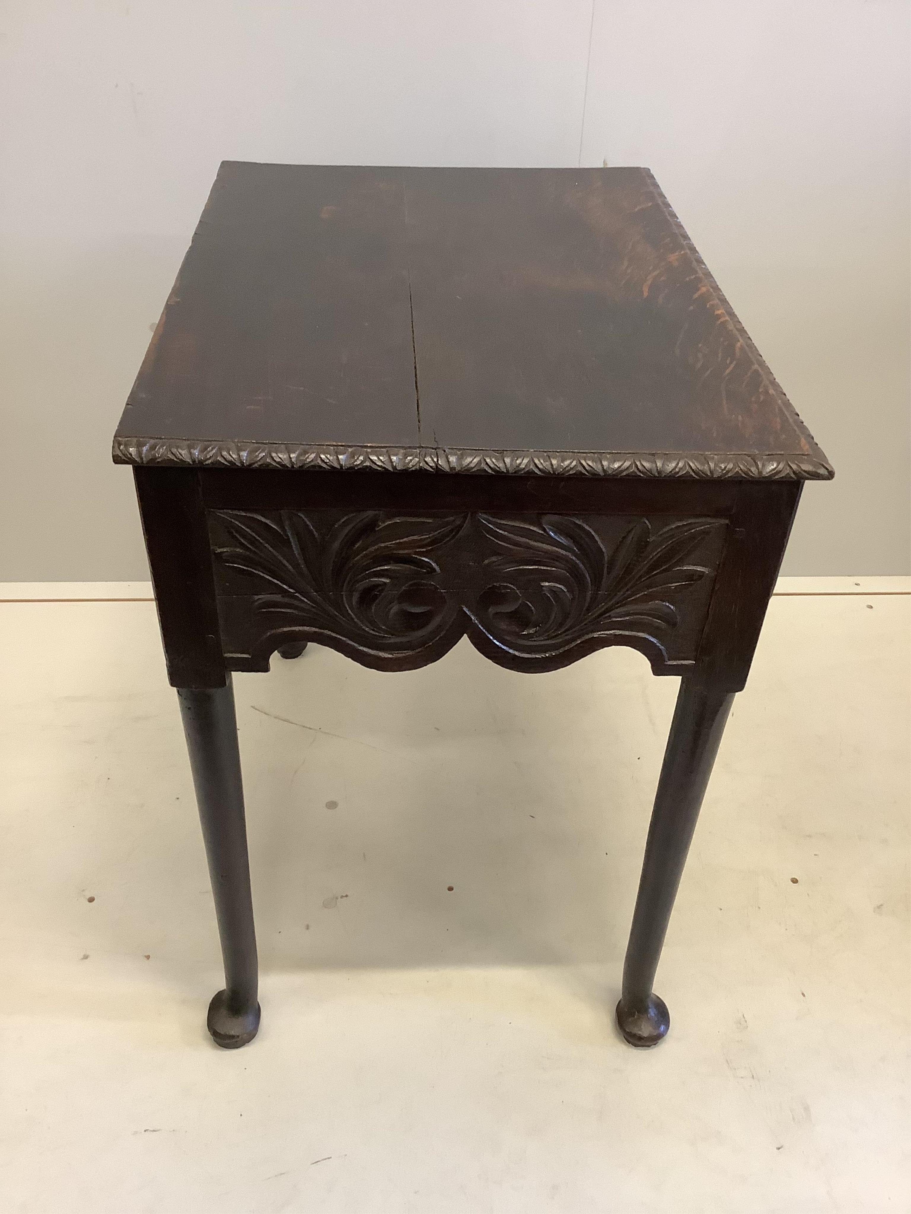 An 18th century oak lowboy, (later carved), width 70cm, depth 50cm, height 73cm. Condition - fair